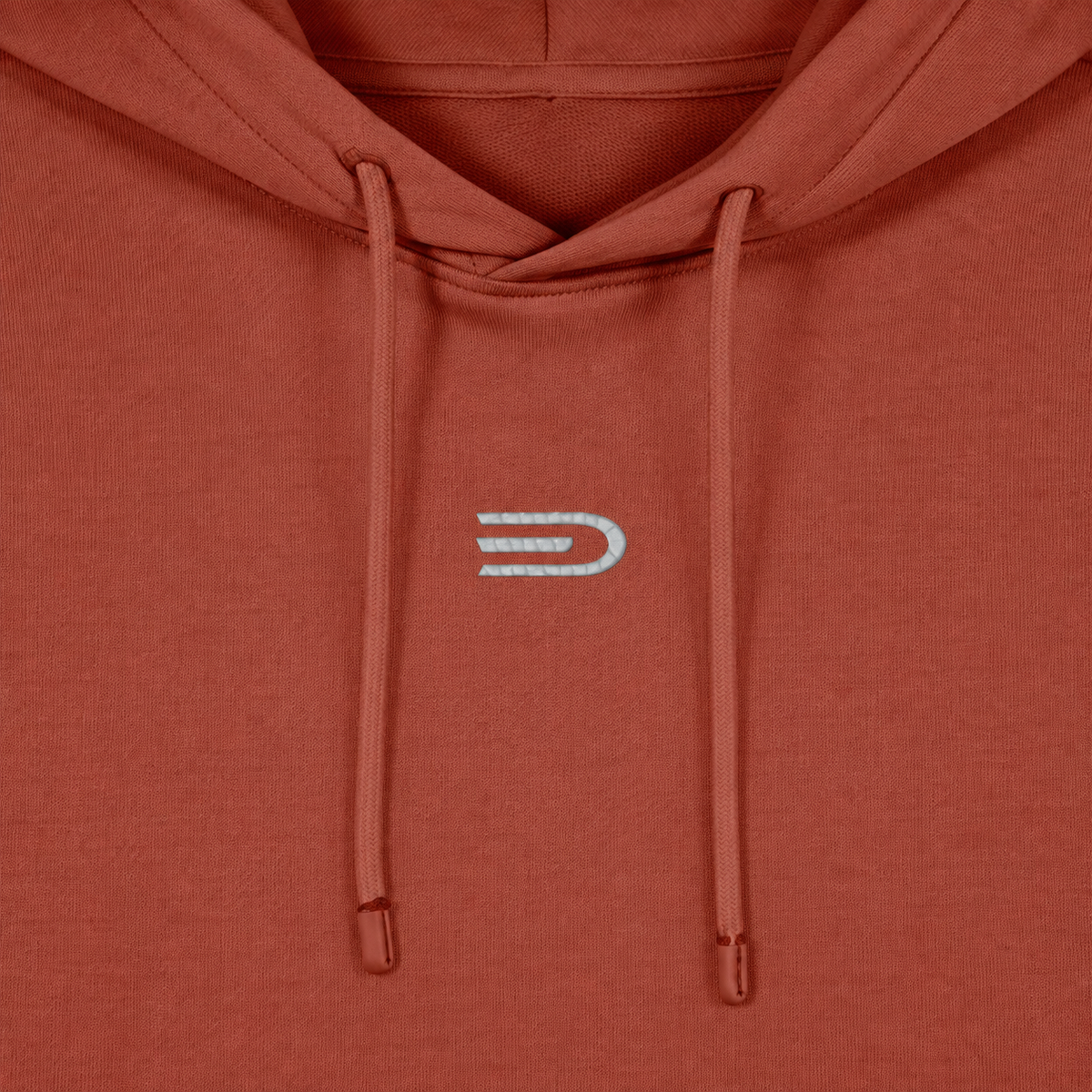 Close detail of Douglas D emblem on rust women's hoodie